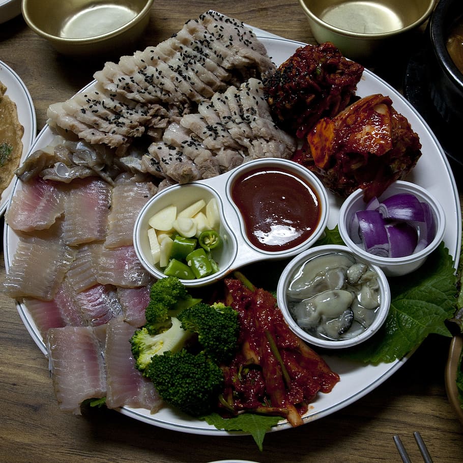 raw, foods, served, white, round tray, skate, three the, pork, wrapped kimchi, oyster