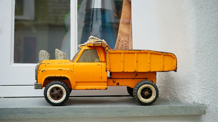 orange, dump, truck toy, placed, glass panel window, toy, truck, vehicle, tonka toy, auto