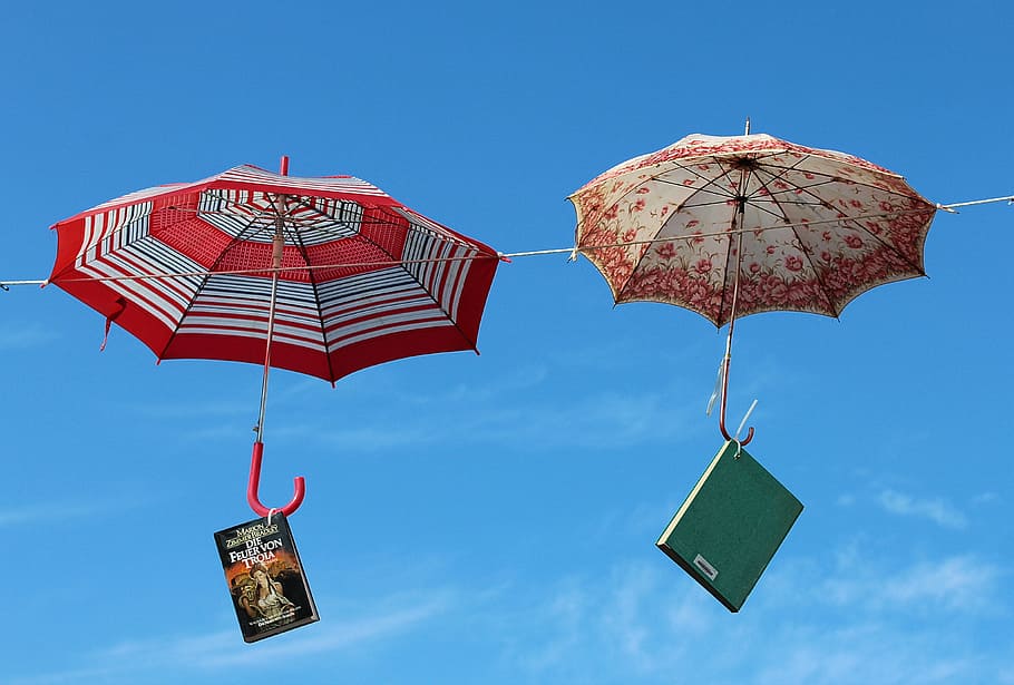 two, red, brown, umbrella, hanging, wire, books, hanging on, screens, umbrellas
