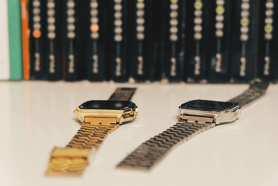 watches, gold, silver, indoors, still life, selective focus, close-up, technology, communication, table