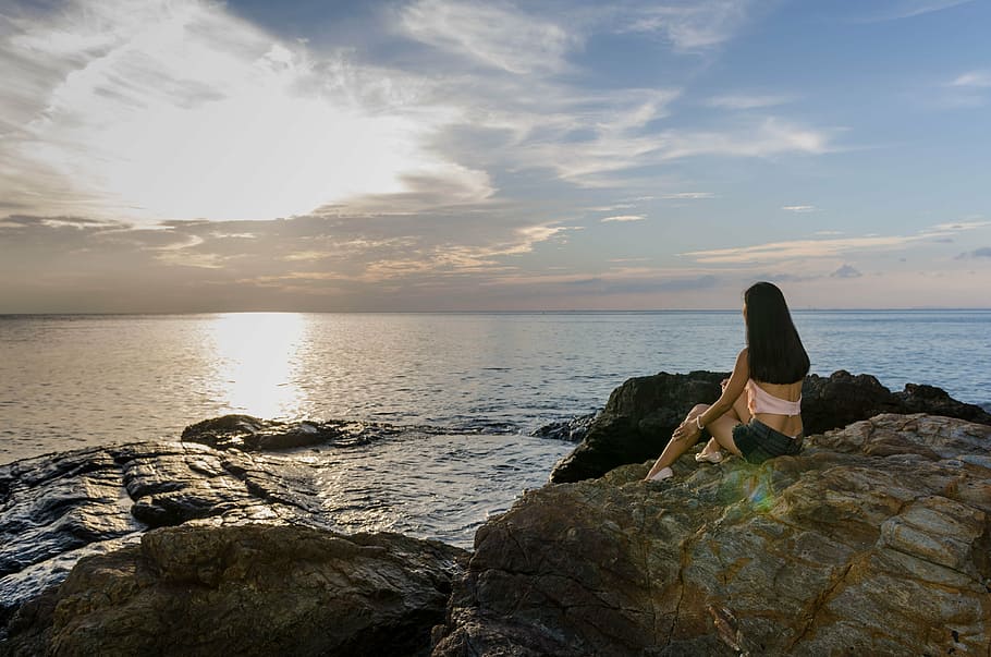woman, sitting, rock formation, front, sea, waiting, sad, drama, sunset, sadness