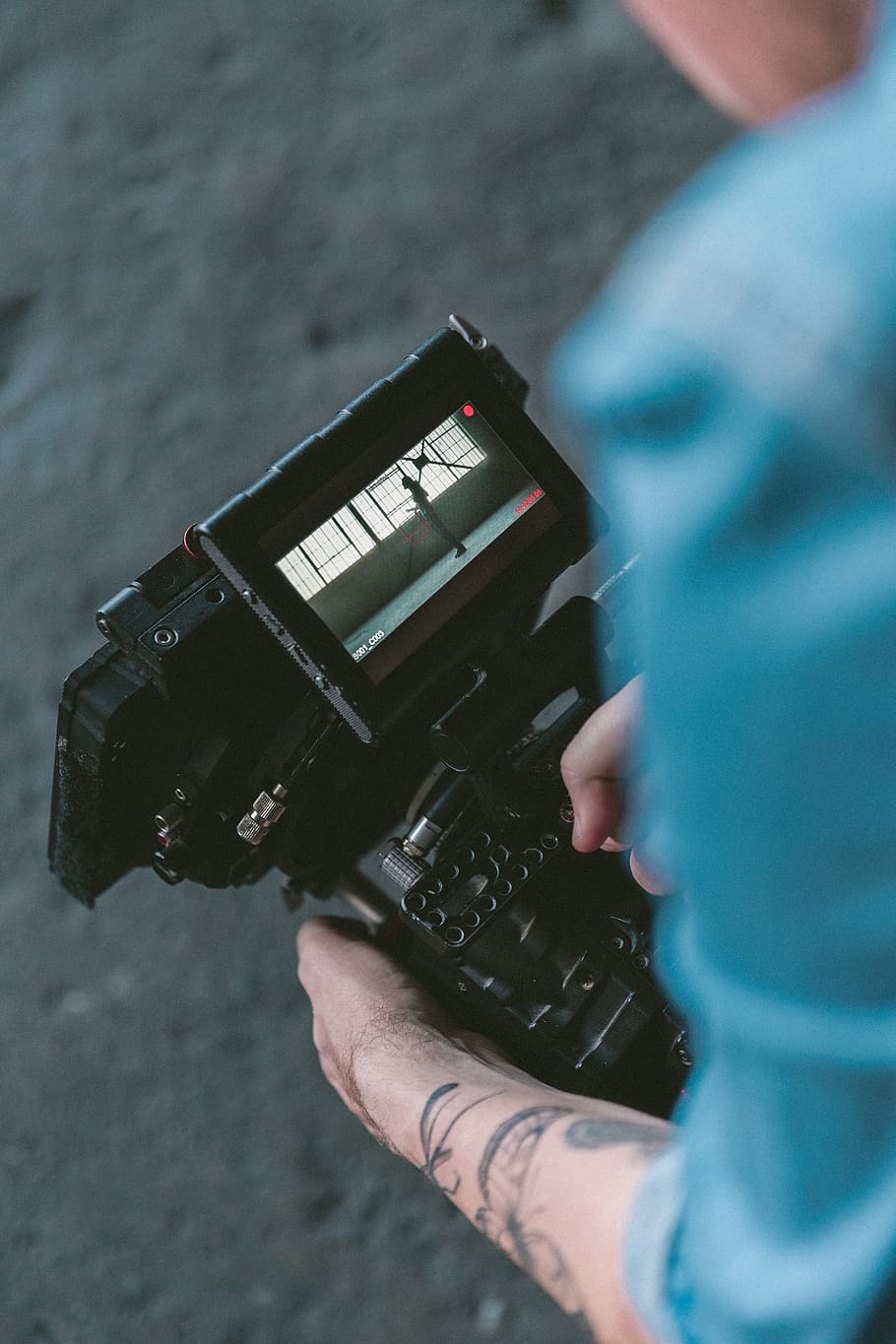 people, man, camera, cinematographer, red, video, production, tattoo, record, film