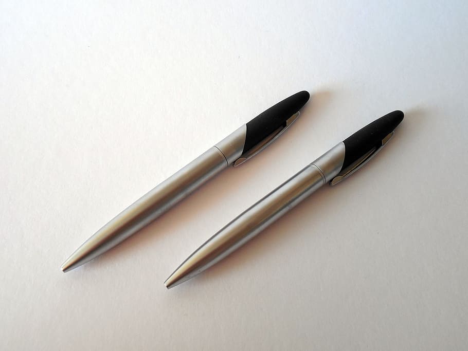 two, silver-and-black, retractable, pens, white, surface, pen, leave, writing tool, coolie