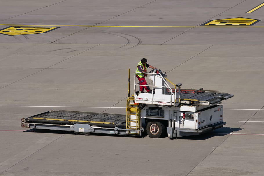 man, riding, airplane ladder, special-purpose vehicle, airport, tarmac, work, tractor, airport tractor, workers