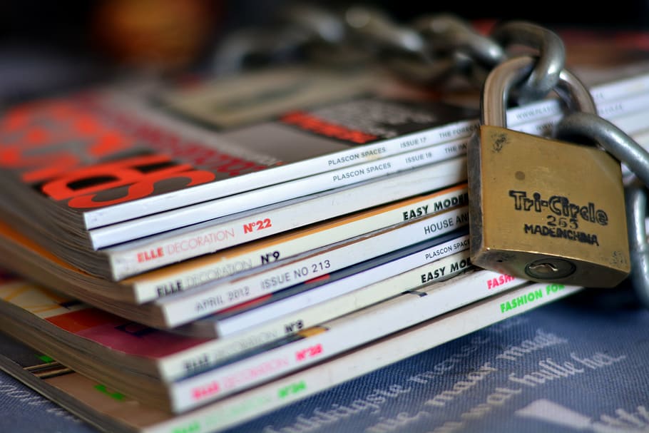 assorted book lot, magazines, lock, chain, secured, safety, selective focus, security, communication, protection
