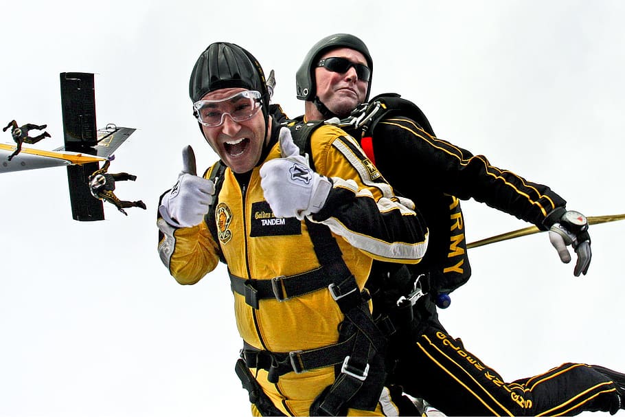 two, men, wearing, black, yellow, safety suits, tandem skydivers, skydivers, teamwork, cooperation