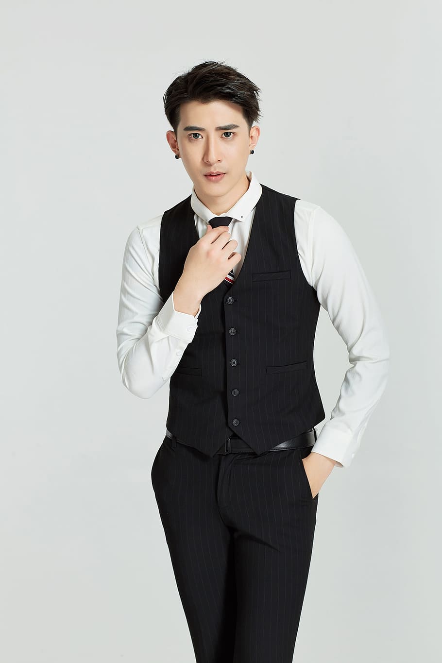 man, wearing, black, button-up vest, white, dress shirt, dress pants outfit, suit, vest, people