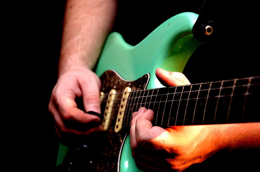 person, holding, green, stratocaster, electric, guitar, electric guitar, events, concert, music