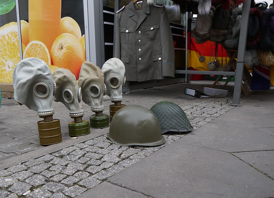 gas mask, army, war, helmet, military, street, container, footpath, city, large group of objects