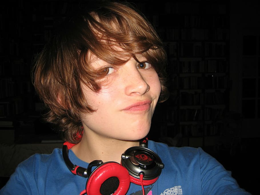 person, wearing, black, red, corded, headphones, blue, shirt, taking, selfie