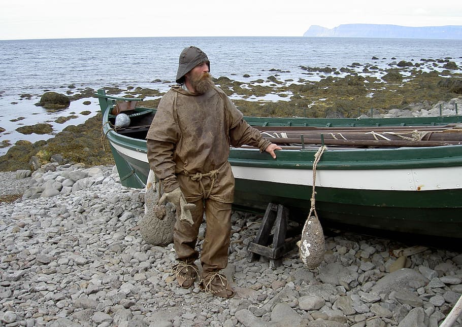 man, wearing, raincoat, standing, fishing boat, iceland, fischer, historically, boot, local