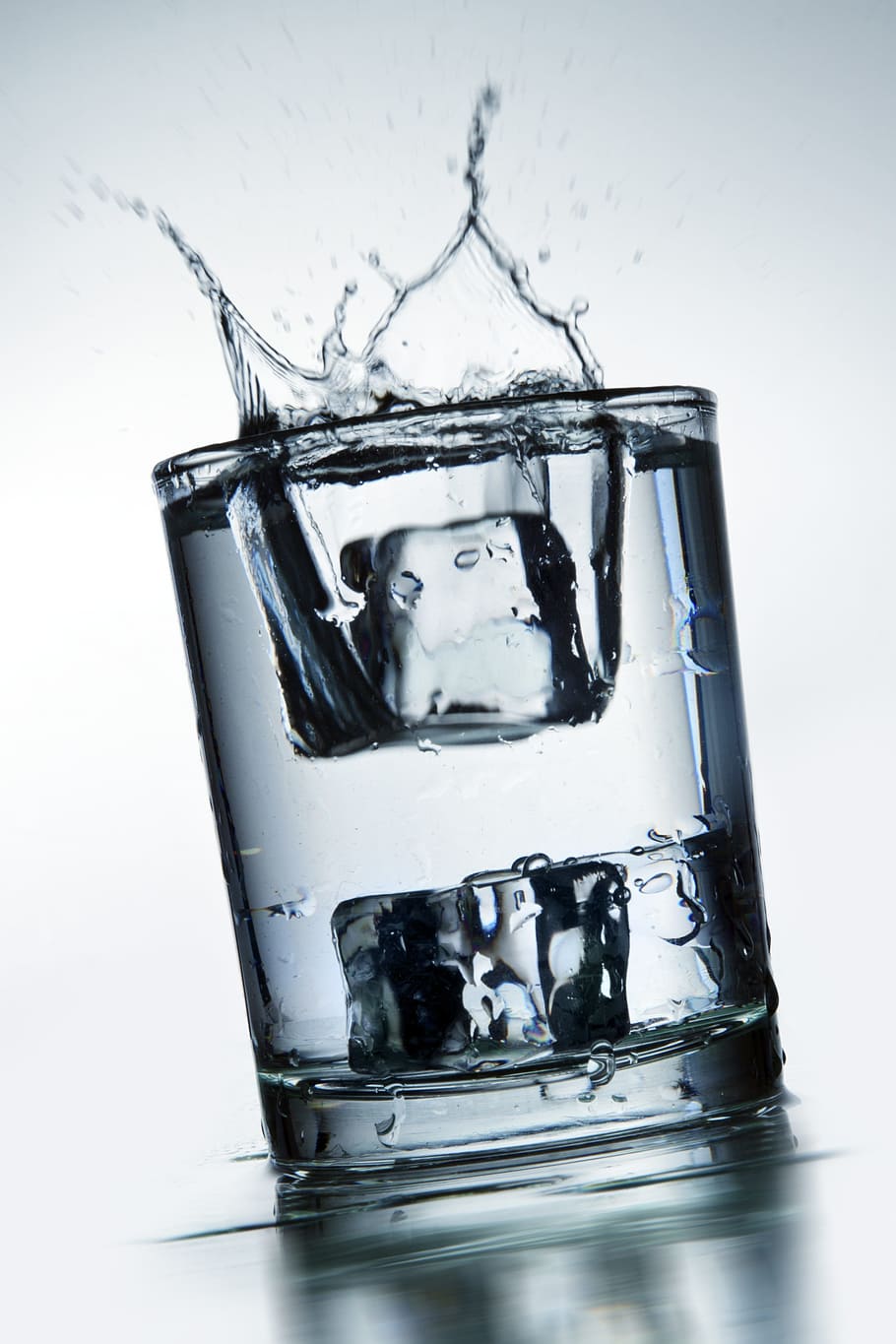 clear, glass, filled, water, two, ice cubes, spilling, motion, pour, liquid