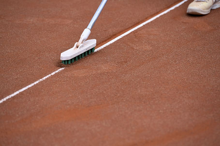 tennis court clay court line broom limit sport human body part