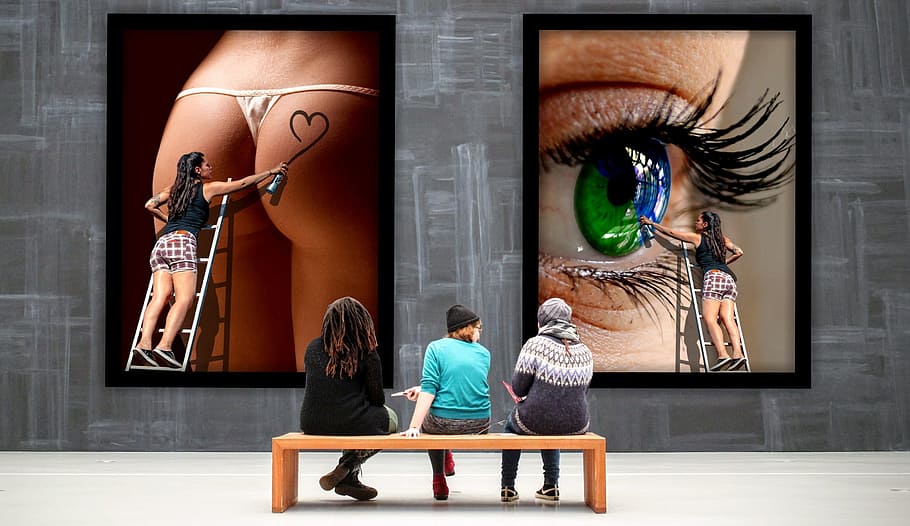 three, people, sitting, wooden, bench, front, two, artworks, gallery, images