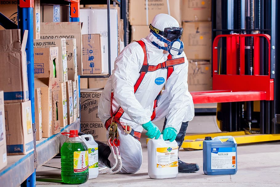 person, holding, white, plastic gallon, chemist, costume, protection, security, logistic, work clothes