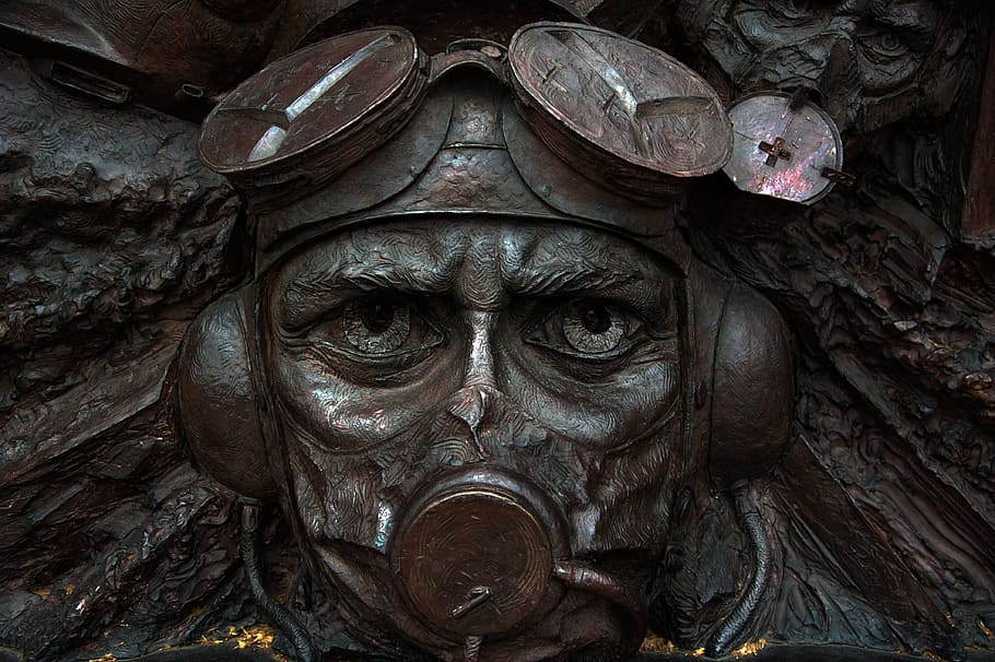 person, wearing, aviation helmet sculpture, london, pilot, english, monument, close-up, day, primate