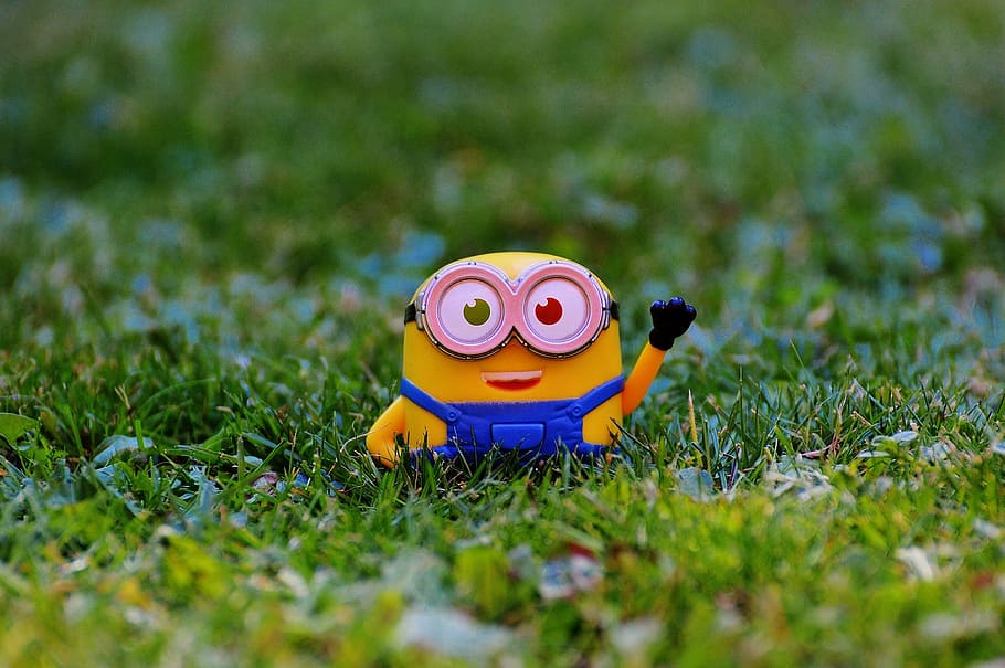 close-up photo, minion figurine, figure, funny, minions, wave, toys, children, yellow, grass