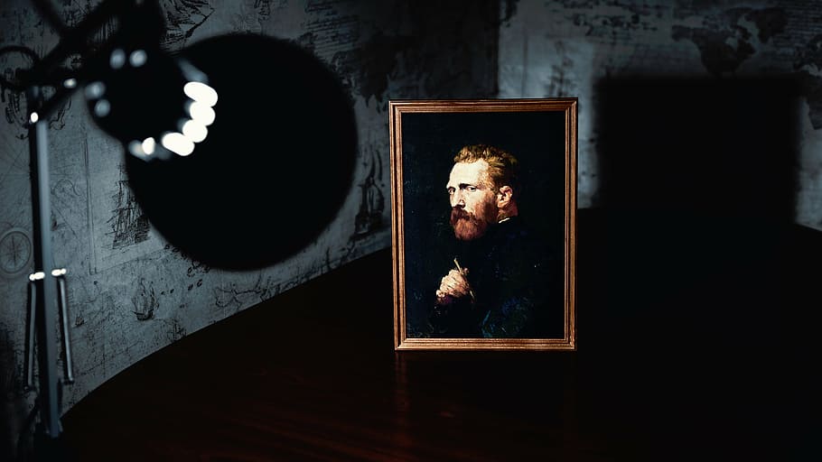 man, wearing, black, coat painting, brown, wooden, frame, turned-on lamp, lamp, light