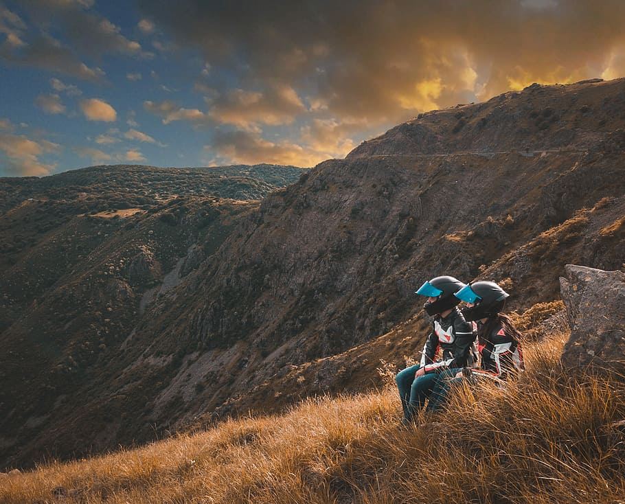 two, person, sitting, grass, overlooking, mountains, golden, hour, bike, motorbike