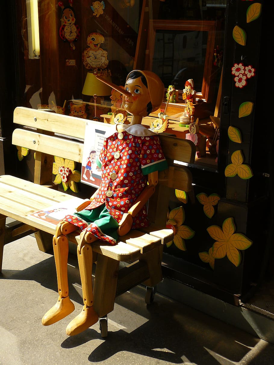 pinocchio, sitting, brown, bench, holzfigur, figure, carving, toys, wooden toys, bank