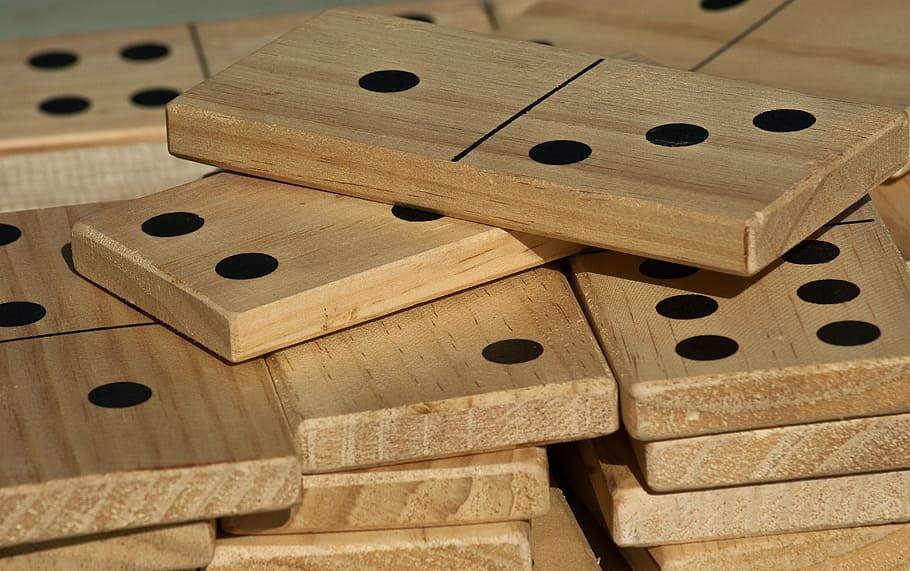 brown domino lot, board game, dominos, play, player, hole, indoors, wood - material, musical instrument, music
