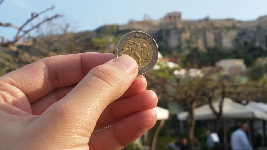 person, holding, round silver-and-gold, colored, coin, acropolis, euro, greece, grexit, euro rescue