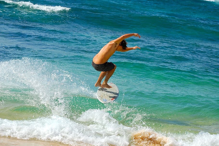 man, playing, skimboarding, blue, body, water, daytime, surfer, waves, hawaii