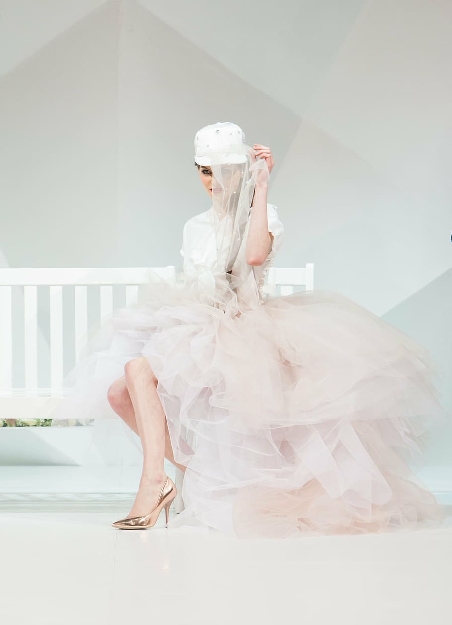 woman, white, pink, dress, sits, wooden, bench, fashion show, fashion, catwalk