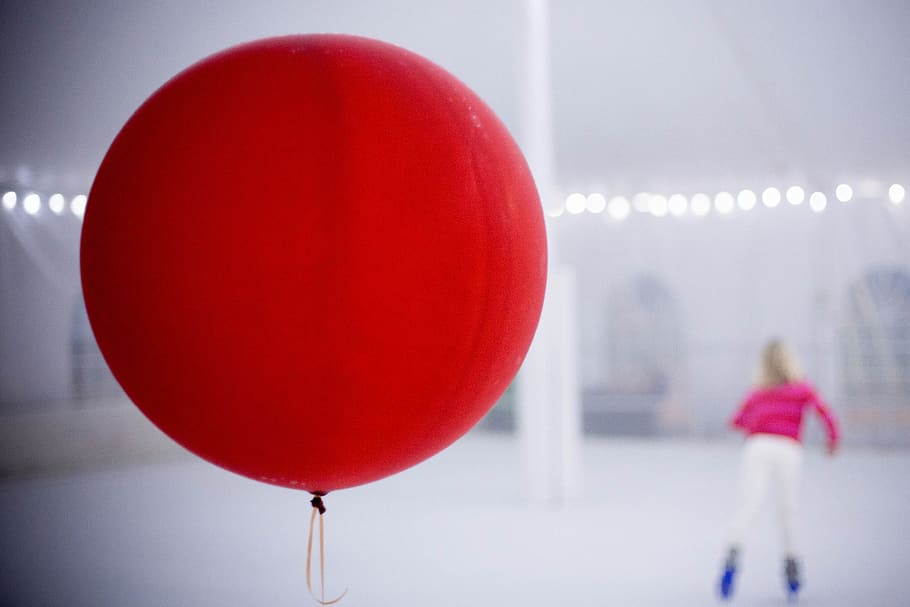 balloon, ice skating, red, women, indoors, adult, focus on foreground, rear view, standing, casual clothing