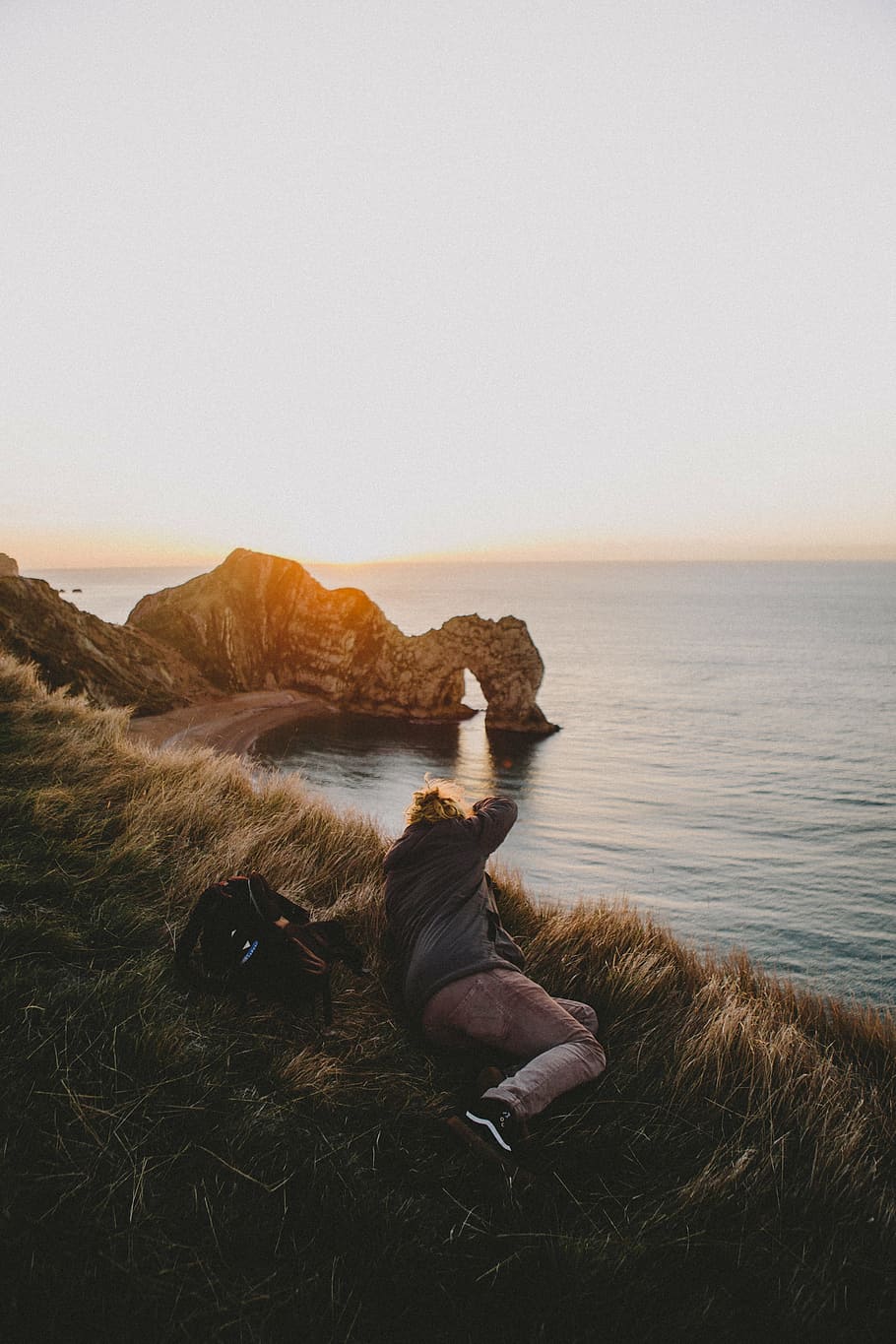 person, laying, front, body, water, grass, blur, coast, sea, sunrise