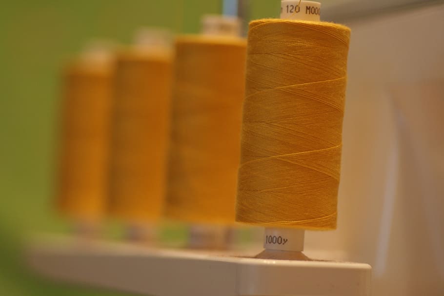 brown thread roll, thread, spool, sewing, overlocker, cotton, polyester, yarn, machine, sew