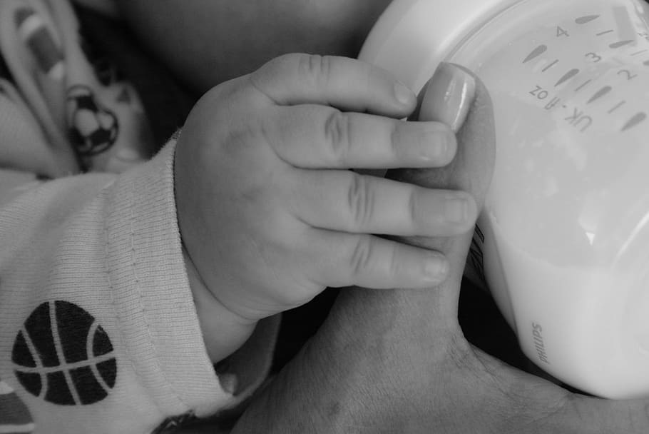 grayscale photography, baby, holding, feeding, bottle, grayscale, photography, babies, hands, lactation