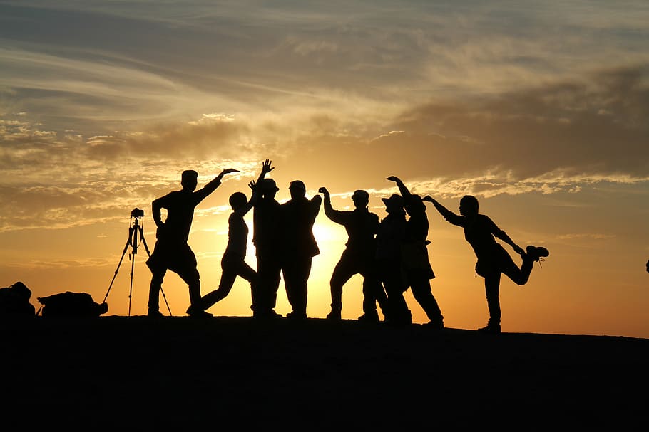 silhouette photo, group, people, silhouette, in xinjiang, ghost city, sunset, joke, together, group of people