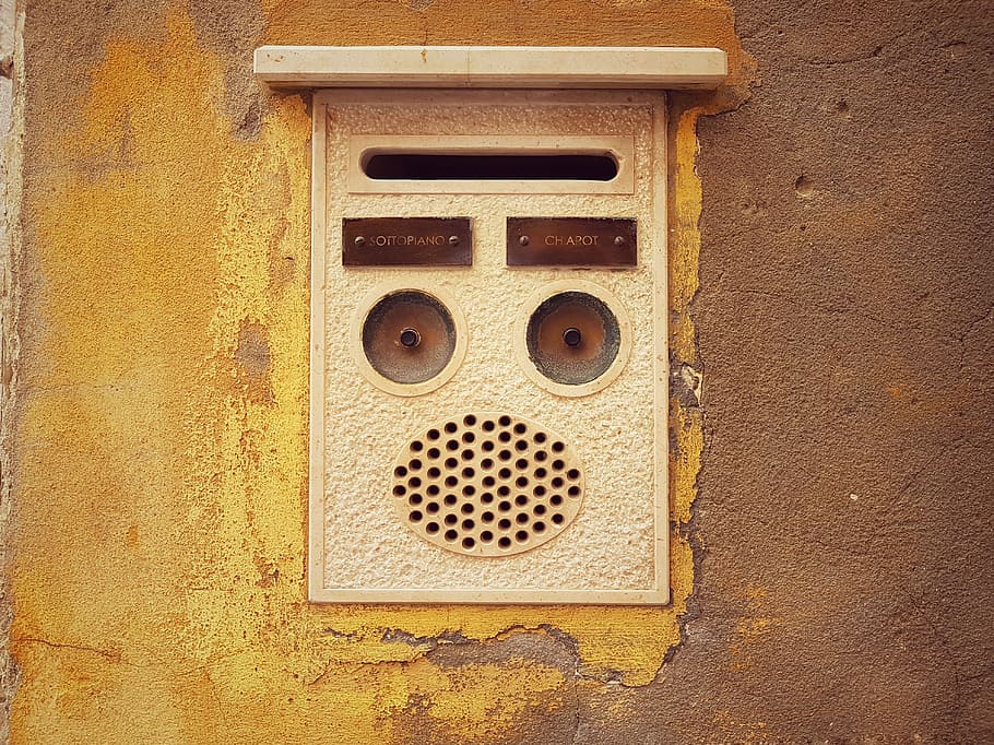 wall, brown, intercom, communiction, yellow, metal, close-up, wall - building feature, shape, hole