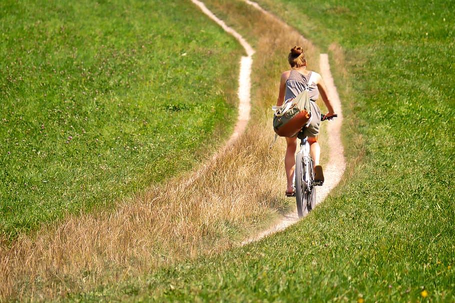 woman, gray, tank, top, riding, bicycle, green, grass field, daytime, cyclists