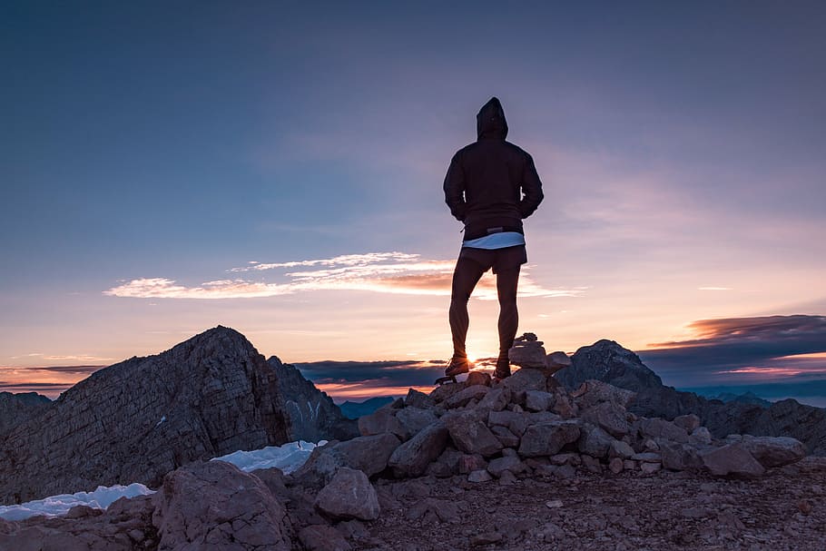 person, top, mountain, hoodie, standing, rocks, sunrise, people, hiking, trekking