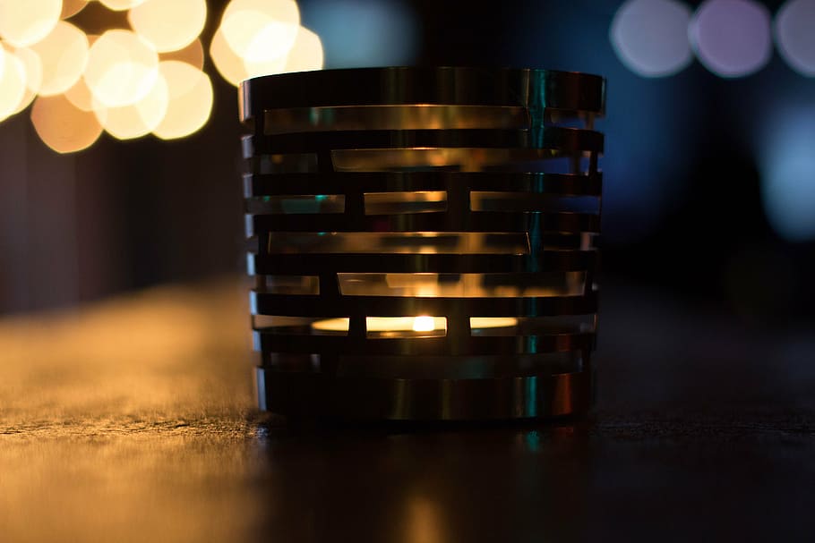 macro shot photography, gray, steel candle holder, candle, light, night, shadow, bar, glass, lamp