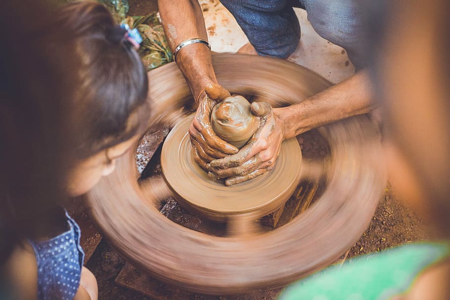 person, making, clay pot, daytime, hands, slow motion, pot, brown, wheel, mud