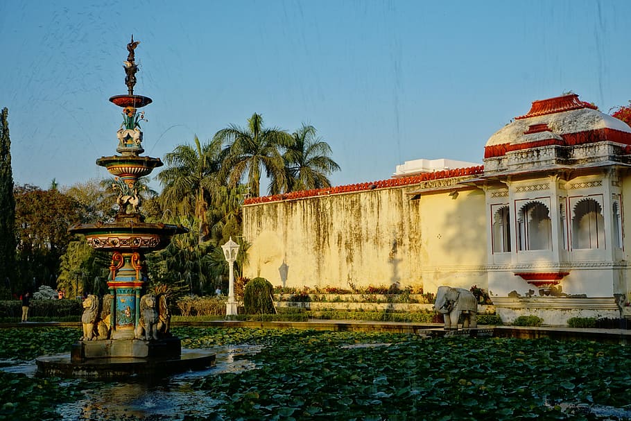 fountain, architecture, travel, park, hinduism, udaipur, built structure, water, sky, building exterior