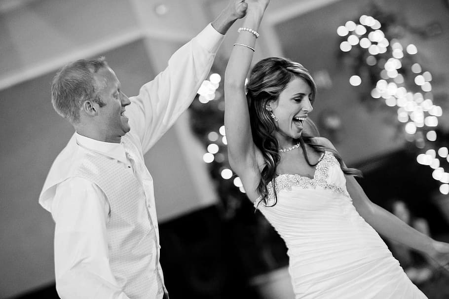 grayscale photo, woman, wearing, sweetheart neckline dress, wedding, party, dance, bride, groom, fun