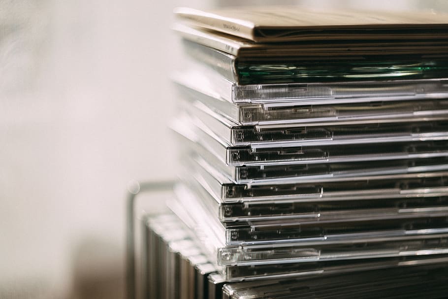 cd, record, music, sound, case, stack, indoors, close-up, selective focus, focus on foreground