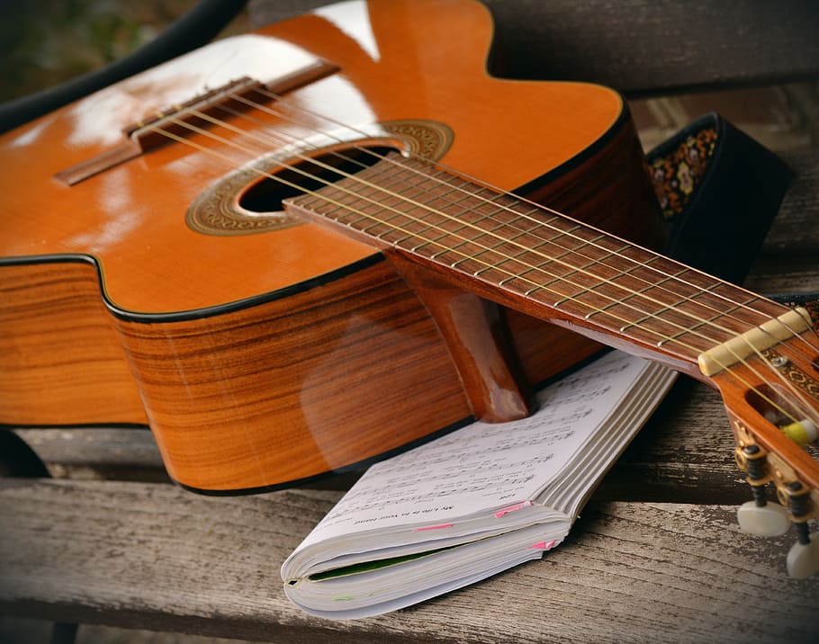 brown classical guitar, guitar, play guitar, musical instrument, song book, music, strings, acoustic guitar, stringed instrument, instrument