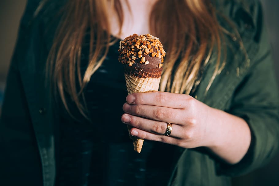 woman, holding, chocolate ice cream cone, people, ice, cream, chocolate, cone, flavor, nuts