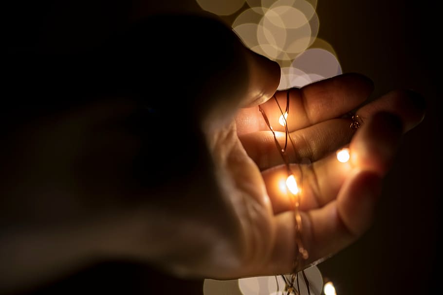 person, holding, string lights, black, string, lights, dark, hand, christmas, light