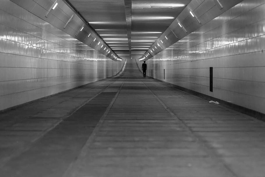 grayscale photo, underground, hallway, pedestrian zone, rotterdam, street, tunnel, walking, architecture, one person