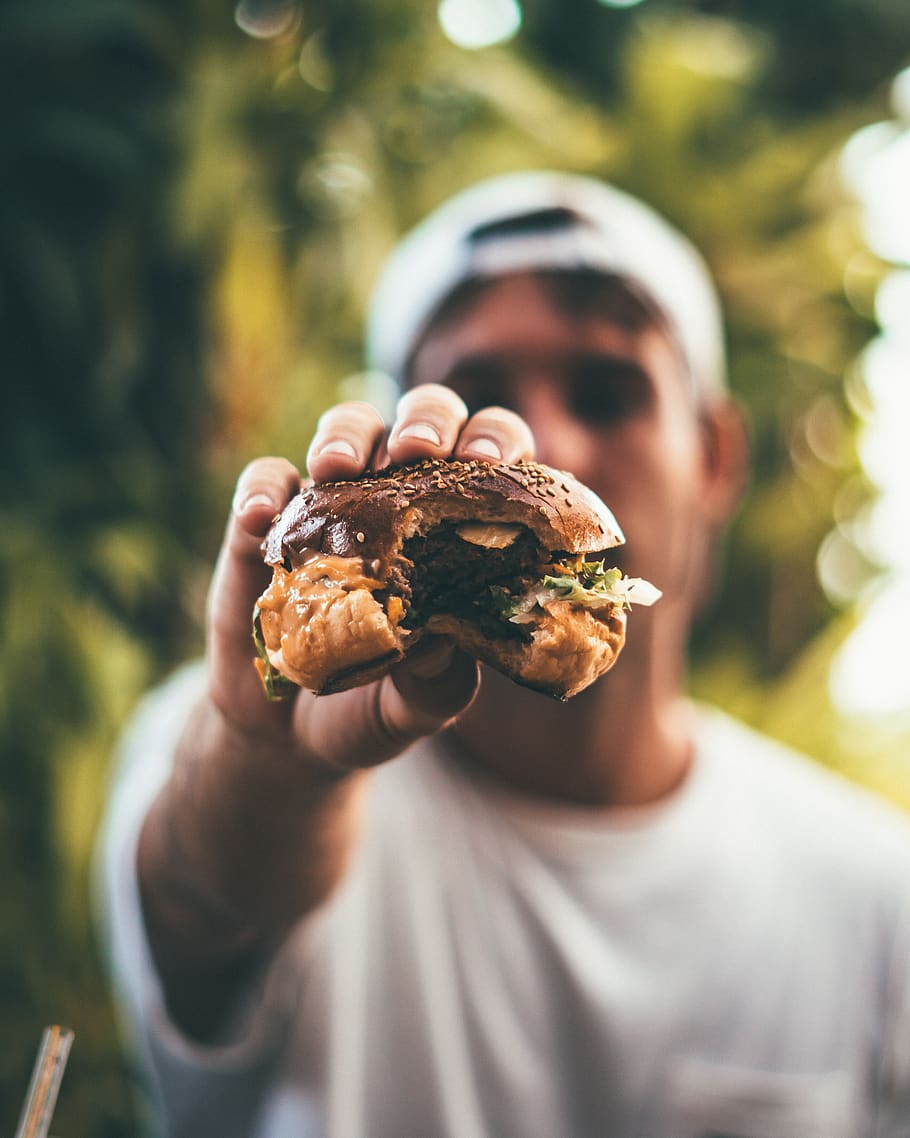 man, eating, burger, hamburger, tasty, food, cap, hat, white, travel
