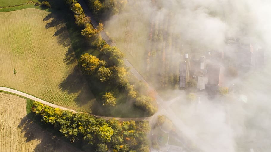 aerial, green, farm land, day, above the clouds, fog, clouds, thunderstorm, storm, gloomy