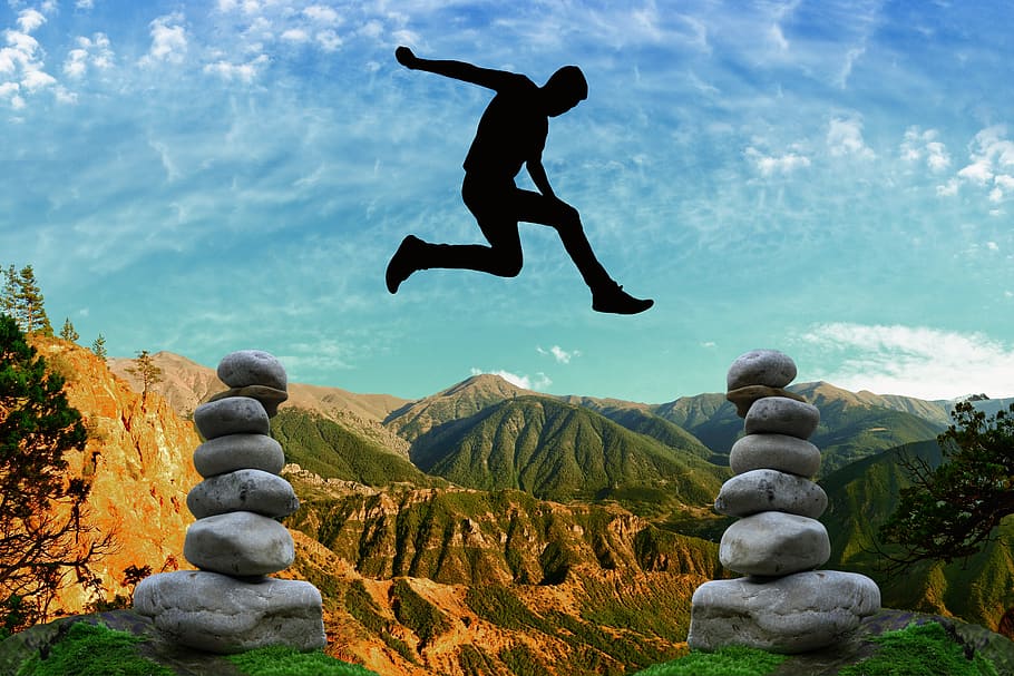 man jumps, two, cairns, risk, courage, balance, risky, high spirits, rock, sky