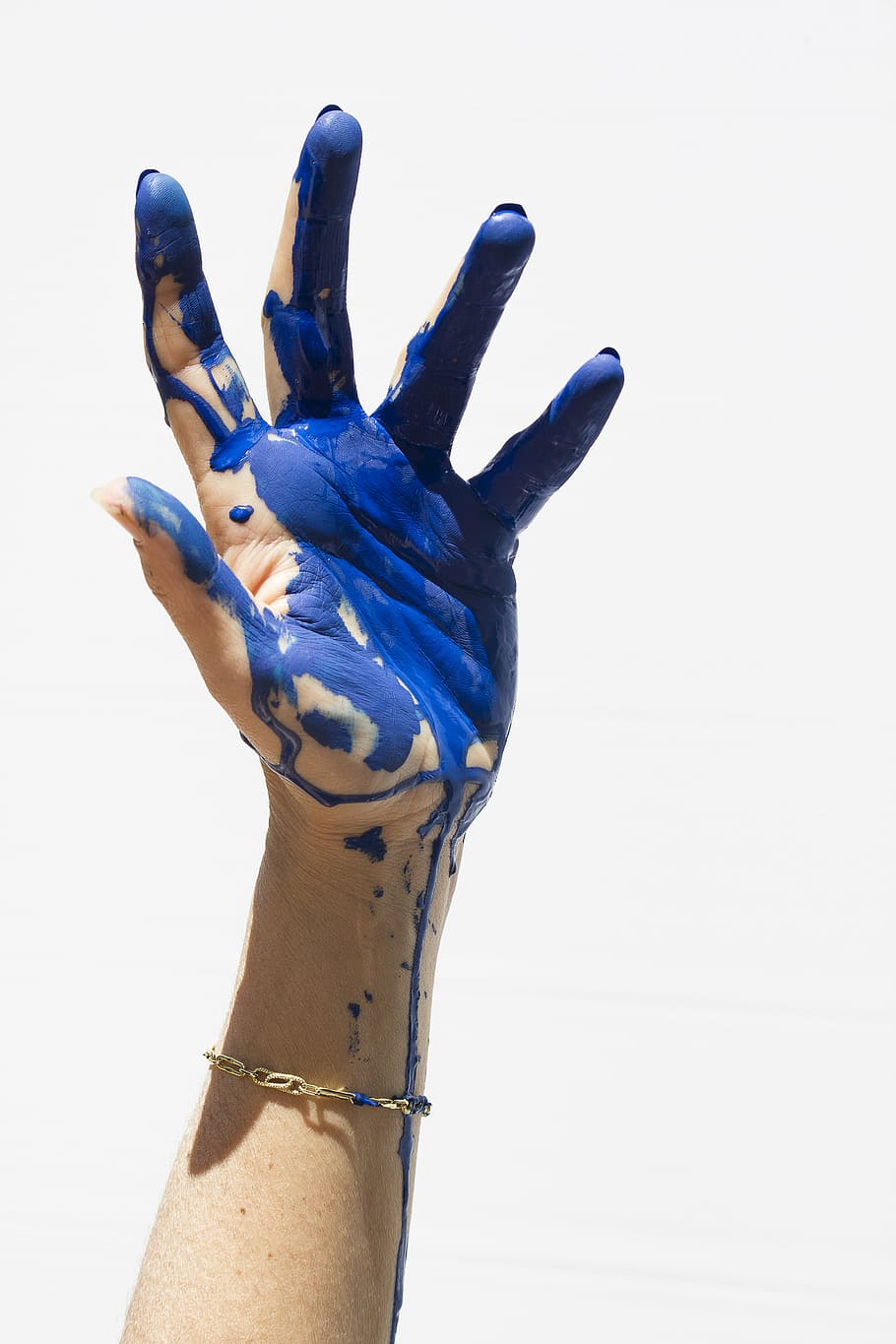 person, wearing, gold-colored bracelet, color, blue, painting, hands, human hand, human body part, human finger
