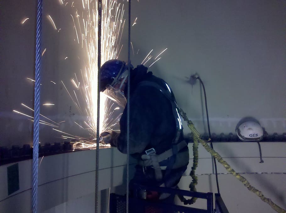 man welding metal, industry, grinding, sparks, steel, industrial, worker, manufacturing, technology, technical
